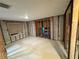 An empty room with exposed concrete block walls and stud framing, ready for renovation at 3960 Headsail Dr, New Port Richey, FL 34652