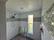 Modern tile shower features decorative tile, window for natural light, and updated shower head at 3960 Headsail Dr, New Port Richey, FL 34652