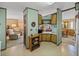 Galley kitchen with wood cabinets and white appliances at 4000 William Hume Dr, Zephyrhills, FL 33541