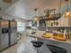 Modern white kitchen with island and wine rack at 4510 W Hanna Ave, Tampa, FL 33614