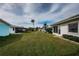 Lush backyard view, showcasing well-maintained lawns and neighborhood views at 5400 Lemon Tree N Ln, Pinellas Park, FL 33782