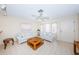 Bright and airy living room with tiled floors and plenty of natural light at 5400 Lemon Tree N Ln, Pinellas Park, FL 33782