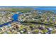 Aerial view of waterfront community with houses and waterways at 8474 Tobay N Rd, St Petersburg, FL 33702