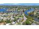 Discover homes along winding canals in this scenic neighborhood with lush trees and the Tampa skyline in the distance at 8474 Tobay N Rd, St Petersburg, FL 33702