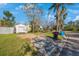 Front yard of a house with storm damage and debris at 8474 Tobay N Rd, St Petersburg, FL 33702