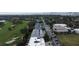 Aerial view of community, showing proximity to golf course and waterfront at 921 Osceola Rd, Belleair, FL 33756