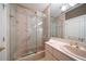 Elegant bathroom with a glass enclosed shower, soaking tub, and updated fixtures at 921 Osceola Rd, Belleair, FL 33756