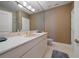 Bathroom with beige vanity, shower, and marble flooring at 921 Osceola Rd, Belleair, FL 33756