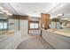 Large bathroom with double vanity, corner soaking tub, and lots of light at 921 Osceola Rd, Belleair, FL 33756