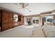 Spacious main bedroom with large windows, built-in wardrobe, and sitting area at 921 Osceola Rd, Belleair, FL 33756