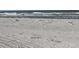 Beachfront view with ocean waves in the background at 9218 Mission Oaks Blvd # E, Seminole, FL 33776