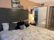 Spacious bedroom with large bed and neutral decor at 9218 Mission Oaks Blvd # E, Seminole, FL 33776
