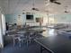 Community room with tables, chairs, and ping pong at 9218 Mission Oaks Blvd # E, Seminole, FL 33776