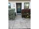 Inviting condo exterior with well-manicured landscaping and private entrance at 9218 Mission Oaks Blvd # E, Seminole, FL 33776