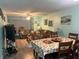Open concept living and dining area with hardwood flooring at 9218 Mission Oaks Blvd # E, Seminole, FL 33776