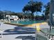 Community pool with surrounding patio furniture at 9218 Mission Oaks Blvd # E, Seminole, FL 33776