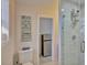 Bathroom with walk-in shower and mini-fridge at 1008 Chester Dr, Clearwater, FL 33756