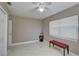 Simple bedroom with a red bench, large window, and closet at 1008 Chester Dr, Clearwater, FL 33756