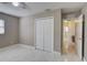 Bright bedroom featuring a large closet and white tile floors at 1008 Chester Dr, Clearwater, FL 33756