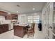 Eat-in kitchen with island seating and stainless steel appliances at 1008 Chester Dr, Clearwater, FL 33756