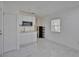 Small kitchenette with white cabinets, microwave, and mini fridge at 1008 Chester Dr, Clearwater, FL 33756