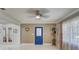 Bright and airy living room with tile flooring and ceiling fan at 1008 Chester Dr, Clearwater, FL 33756