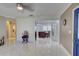 Spacious living room featuring tile floors and a view into the kitchen at 1008 Chester Dr, Clearwater, FL 33756