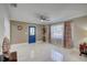 Bright living room with tile flooring and a view into the kitchen at 1008 Chester Dr, Clearwater, FL 33756