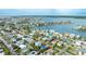 Aerial view showcasing a house and neighborhood near the water at 16202 3Rd St E, Redington Beach, FL 33708