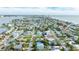 Aerial view showcasing a house and neighborhood near the water at 16202 3Rd St E, Redington Beach, FL 33708