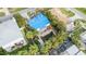 Aerial view of house with damaged roof and pool at 16202 3Rd St E, Redington Beach, FL 33708