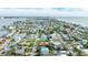 Aerial view showcasing a house and neighborhood near the water at 16202 3Rd St E, Redington Beach, FL 33708