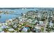 Aerial view showcasing a house and neighborhood near the water at 16202 3Rd St E, Redington Beach, FL 33708