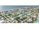 Aerial view of coastal neighborhood, showcasing houses near beach at 16202 3Rd St E, Redington Beach, FL 33708