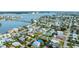 Aerial view showcasing a house and neighborhood near the water at 16202 3Rd St E, Redington Beach, FL 33708