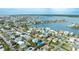Aerial view showcasing a house and neighborhood near the water at 16202 3Rd St E, Redington Beach, FL 33708