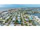 Aerial view showcasing a house and neighborhood near the water at 16202 3Rd St E, Redington Beach, FL 33708