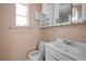 Small bathroom needing renovation with toilet and sink at 16202 3Rd St E, Redington Beach, FL 33708