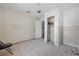 Simple bedroom with tiled floors and a closet at 16202 3Rd St E, Redington Beach, FL 33708