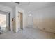 Hallway with tiled floors, closet, and doors to other rooms at 16202 3Rd St E, Redington Beach, FL 33708