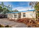 House exterior showing storm damage and debris at 16202 3Rd St E, Redington Beach, FL 33708
