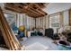 Room in need of renovation; filled with debris and building materials at 16202 3Rd St E, Redington Beach, FL 33708
