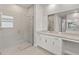 Modern bathroom with a glass-enclosed shower and a spacious vanity area at 18424 Vista Park Ter, Venice, FL 34293