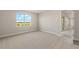 Bright bedroom with a large window providing a scenic view and natural light at 18424 Vista Park Ter, Venice, FL 34293