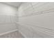 Spacious walk-in closet with built-in shelving for optimal storage and organization at 18424 Vista Park Ter, Venice, FL 34293