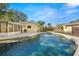 Inviting swimming pool with patio and screened enclosure at 1897 Harmony Dr, Clearwater, FL 33756