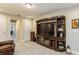 Bonus room features an entertainment center and built-in shelving at 2113 Sunset Wind Loop, Oldsmar, FL 34677