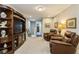 Spacious bonus room with two leather recliners and an entertainment center at 2113 Sunset Wind Loop, Oldsmar, FL 34677