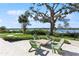 Relaxing patio area with seating and waterfront views at 2113 Sunset Wind Loop, Oldsmar, FL 34677