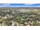 Overhead view of a neighborhood with lush trees and a tennis court at 2358 Havana Dr, Clearwater, FL 33764